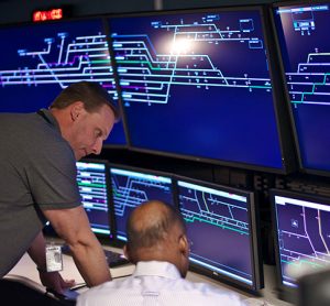 Wabtec workers looking at a screen