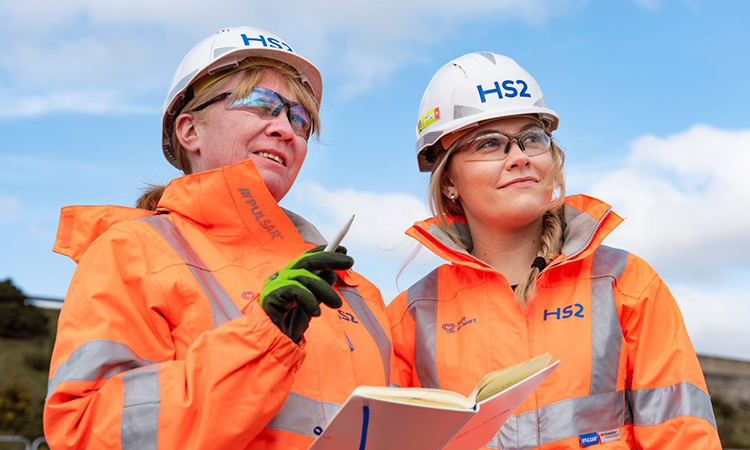 HS2 workers looking off into the distance