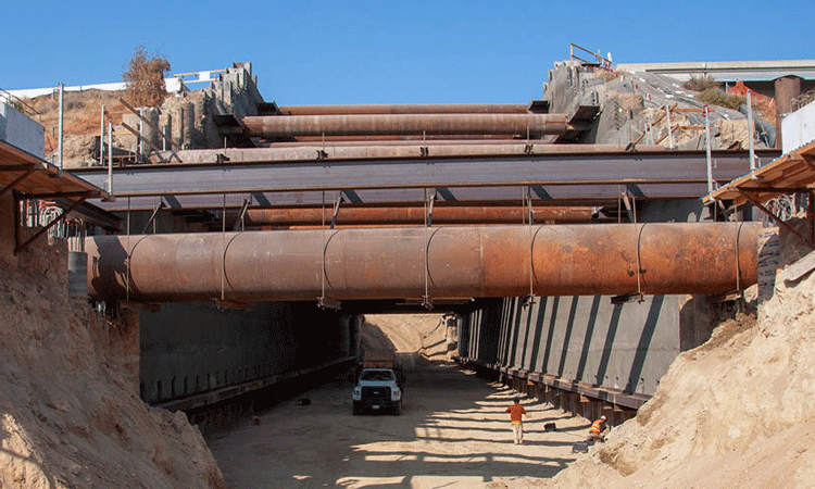 Workers continue excavating the crossing under State Route 180 (SR 180) outside of downtown Fresno.