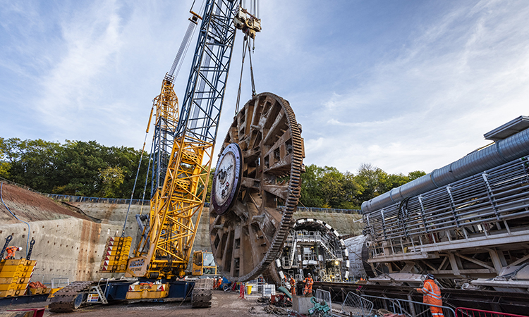 'Dorothy' TBM's giant cutterhead being lifted into place during reassembly