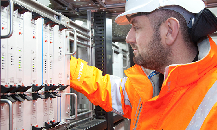 An engineer testing new signalling equipment