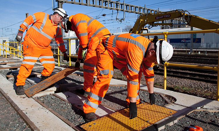 Engineers fitting new cables as part of the East Coast Digital Programme