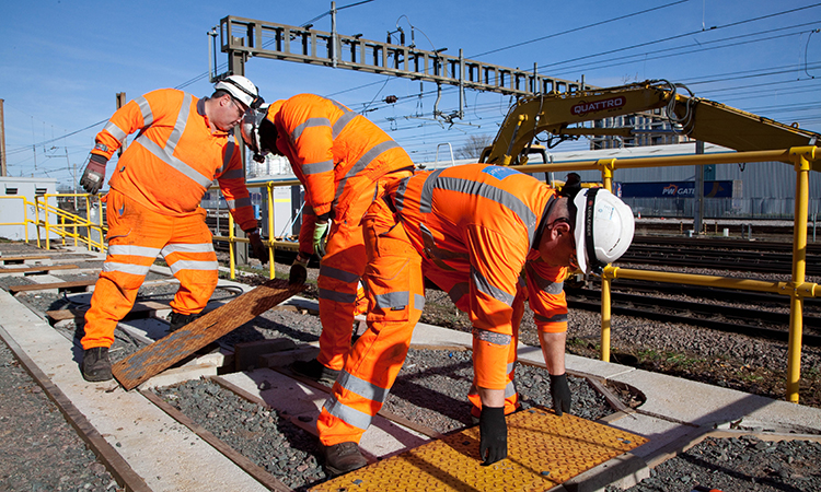 Engineers fitting new cables as part of the East Coast Digital Programme