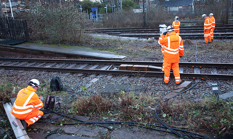 Engineers install new lineside equipment