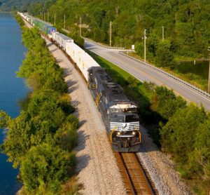 A Norfolk Southern locomotive travelling amongst a natural environment