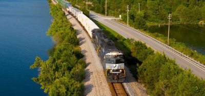 A Norfolk Southern locomotive travelling amongst a natural environment
