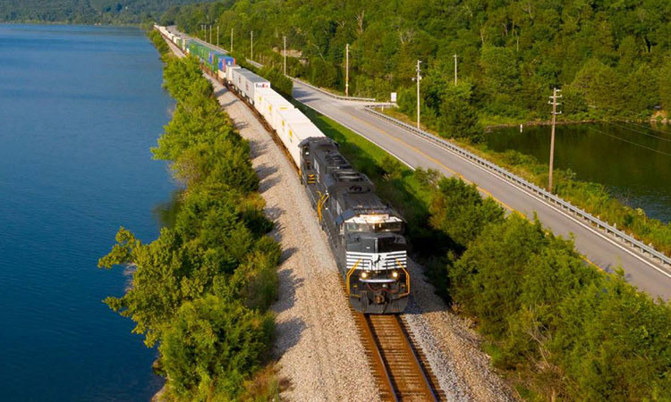 A Norfolk Southern locomotive travelling amongst a natural environment