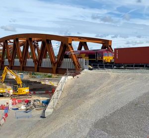 The first train travels over the SAS 13 bridge