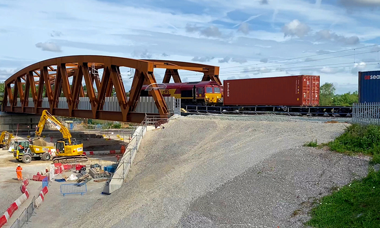 The first train travels over the SAS 13 bridge