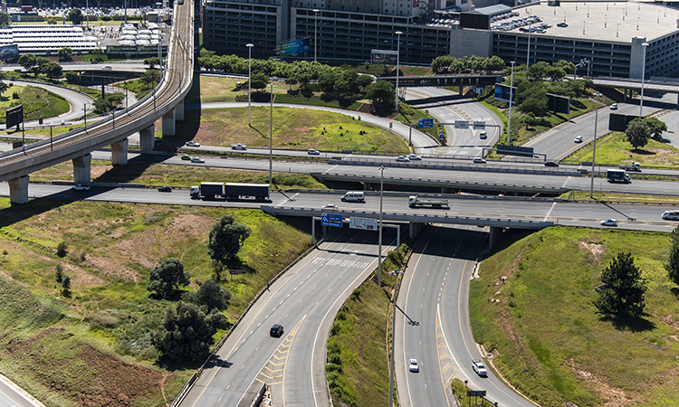 Gautrain viaduct crossing over the highway from O.R. Tambo International Airport station
