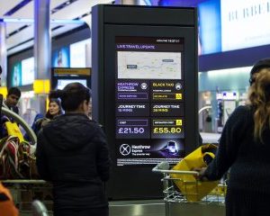Heathrow Express and taxi comparison smart screens installed at Heathrow Terminal 2