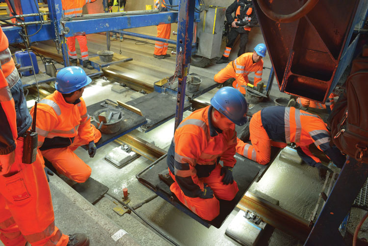 Engineers laying the ballastless railway track