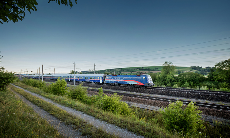 The ÖBB Nightjet travelling through der Landschaft