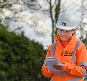 An ORR employee making notes