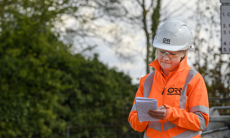 An ORR employee making notes