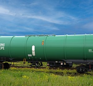 Green freight train operated by Greenbrier Leasing Europe with GBX logo visible on the wagon side