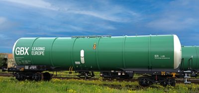 Green freight train operated by Greenbrier Leasing Europe with GBX logo visible on the wagon side