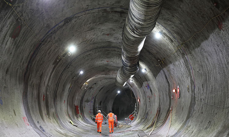 MDJV colleagues walk through the traction substation tunnel at Euston, discussing the works and the tunnel's purpose to redirect services and provide ventilation to the new traction substation, known as the Sugar Cube.