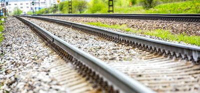 Railroad track rails in country landscape