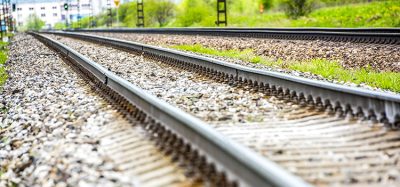 Railroad track rails in country landscape