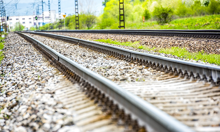 Railroad track rails in country landscape