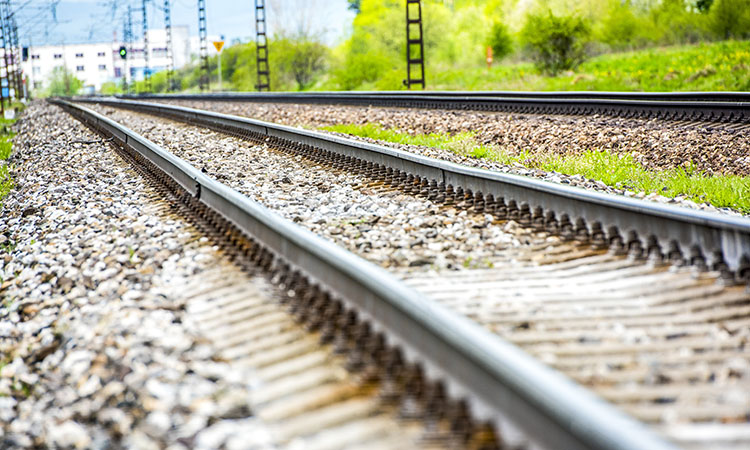 Railroad track rails in country land space