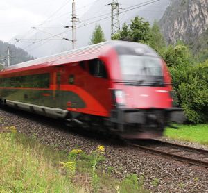 ÖBB captured in motion travelling through the mountains.