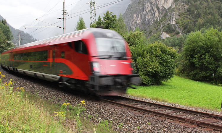ÖBB captured in motion travelling through the mountains.