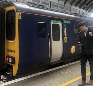This image shows the new whatsapp service being used next to a Northern train
