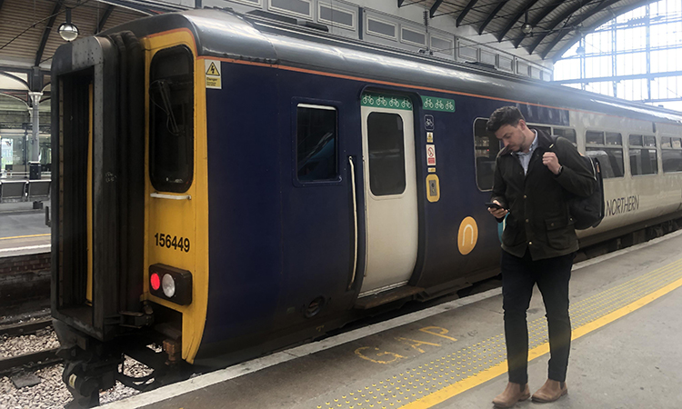 This image shows the new whatsapp service being used next to a Northern train