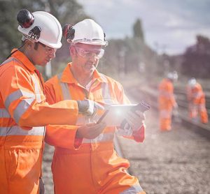 Railway workers using tablet