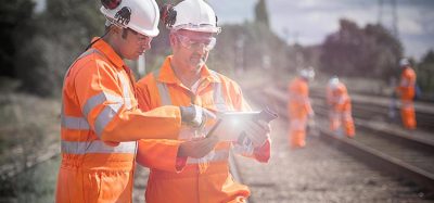 Railway workers using tablet