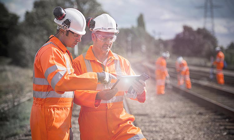 Railway workers using tablet