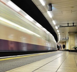 Tube train pulling out of station