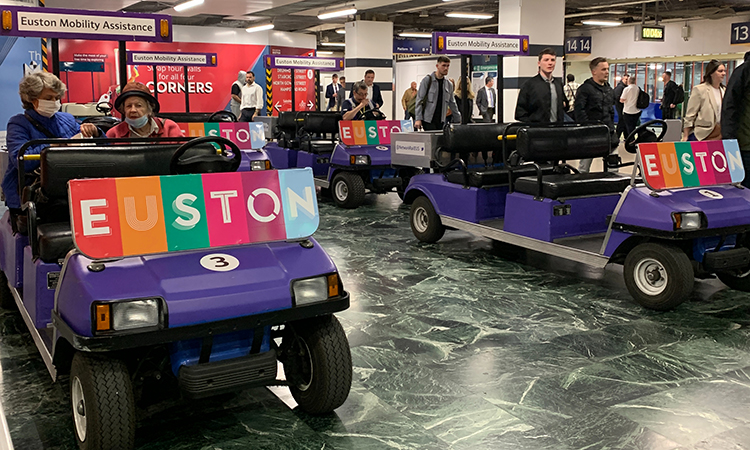 Two passenger assistance buggies that have been replaced by newer, electric machines.