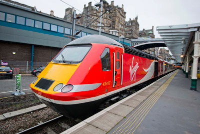 Virgin Trains East Coast will receive a £21 million overhaul of its 45 high speed diesel trains as part of a £40 million commitment to improve its fleet since launching the east coast franchise in March 2015. The programme is part of a package to invest £140 million over eight years. The £21 million investment will be spent on the complete refurbishment of the train’s interiors. A total of 401 carriages will be overhauled with 24,123 seats replaced along with refurbished toilets, new carpets and curtains. Leather seats will be fitted in First Class. Upgrade work will be carried out at Virgin Trains Bounds Green depot in London and its Craigentinny depot in Edinburgh, where it will also fit 35 new engines to its diesel high speed train fleet as part of a £16 million contract with engine manufacturer MTU. External work will also be carried out on the trains taking the investment to more than £40 million. David Horne, Managing Director of Virgin Trains on the east coast route, said: “Since Virgin started running this railway, the bar has been raised by customers who rightly demand a high quality customer experience, something which they would expect from a Virgin business, as well as getting great value for money. “And that’s exactly what we’ve been working hard to deliver, with this multi million investment in our trains not only one of the biggest investments of its kind ever seen on the east coast route, but also three years ahead of the introduction of new Super Express Trains as part of the Government’s InterCity Express programme. “We’re investing now so our customers can benefit from new seats and a great new on-board environment before we get a new fleet of 65 trains from 2018.” The first refurbished train will enter service on 14 December 2015 coinciding with the launch of Virgin Train new service between Sunderland and London. Trains East Coast to receive 21 million pound refurbishment