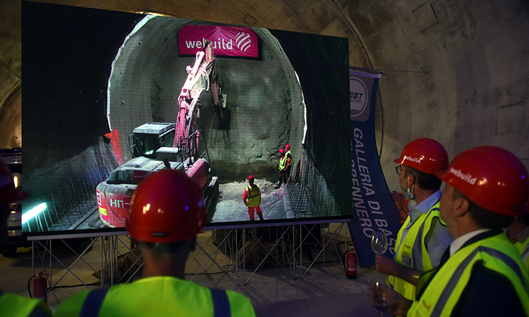 Webuild workers witness the completion of tunnel work under Brenner.