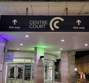 A new sign intending to make wayfinding easier for passengers at Wimbledon station