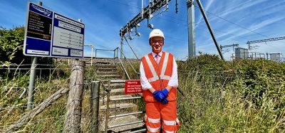 Rob McIntosh, Managing Director for Network Rail's Eastern region, next to the first new electric overhead wires on a mainline in Yorkshire for 25 years.