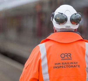 ORR inspector at work looking over a British railway