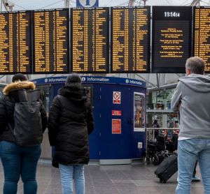 Passengers looking at a timetable