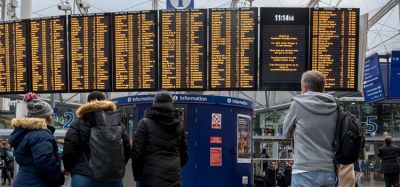 Passengers looking at a timetable