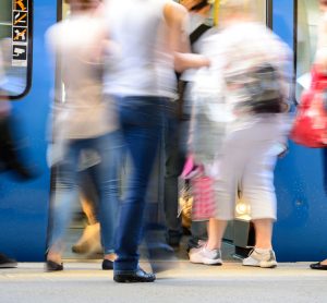 passengers boarding and exiting a train