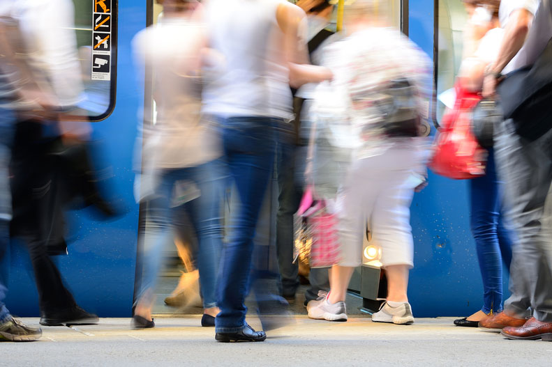 passengers boarding and exiting a train