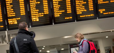 Passengers in front of screen.