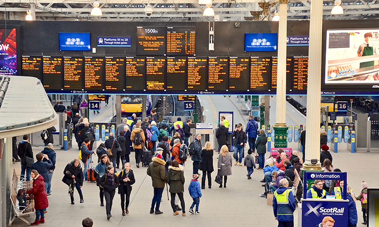 Waverley train station, people looking at information boards on the concourse. Edinburgh city, Scotland UK. February 2018 2018