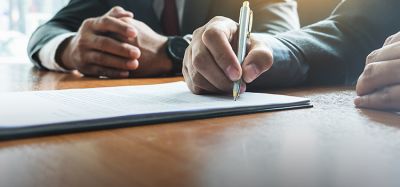Business man sign a contract investment professional document agreement.