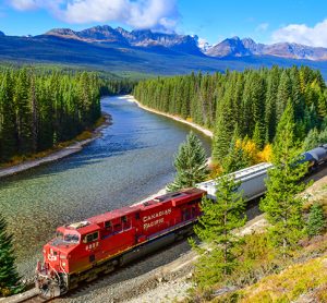 Long freight train Canadian Pacific Railway (CPR) moving along Bow river in Canadian Rockies ,Banff National Park, Canadian Rockies,Canada.