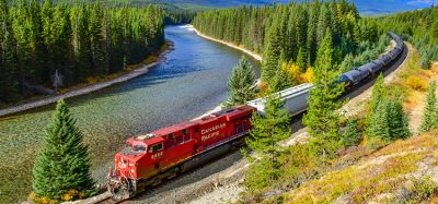 Long freight train Canadian Pacific Railway (CPR) moving along Bow river in Canadian Rockies ,Banff National Park, Canadian Rockies,Canada.