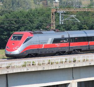 Italy high speed train crossed country at speed, the motor car in the rear.